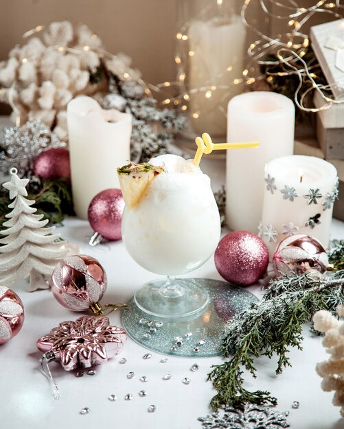 Milkshake candles and toys on the table