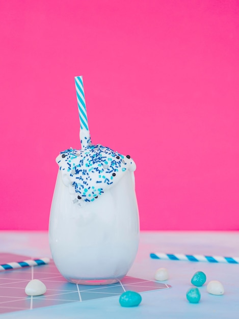 Milkshake glass with pink background