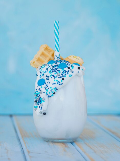 Milkshake glass on wooden table