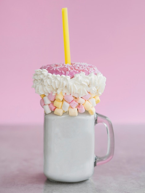 Milkshake jar with pink background