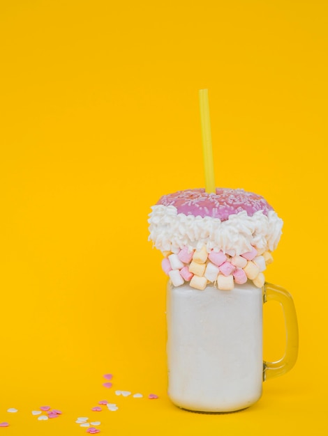 Milkshake jar with yellow background