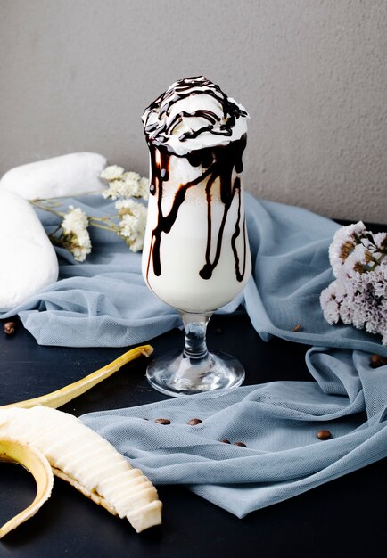 Milkshake with whipping cream and chocolate topping