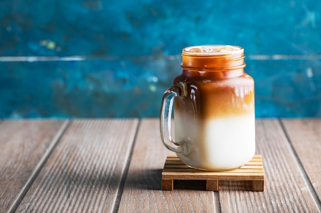 Milky cold summer drink with caramel sauce