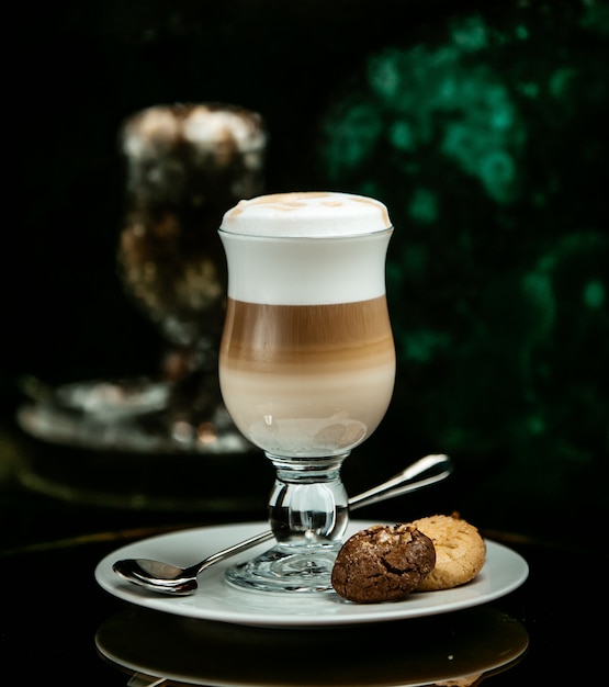 Milky latte with chocolate and vanilla biscuit cookies.