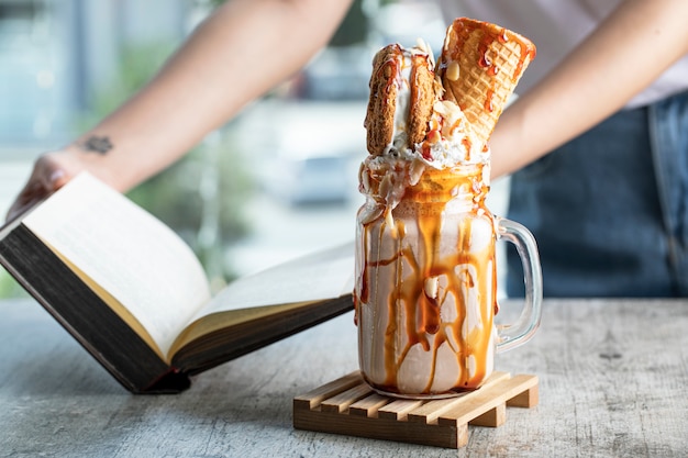 Milky summer cocktail with waffle and mapple syrup