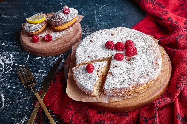 Millefeuille cake with raspberries and sugar powder. 