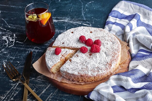 Millefeuille cake with sugar powder and a glass of glintwine. 