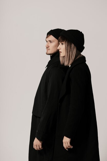 Millennial fashion couple on a white in studio