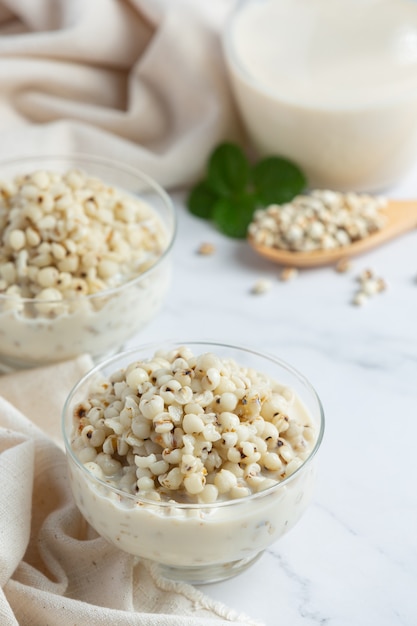 Millet coconut milk dessert in glass bowl