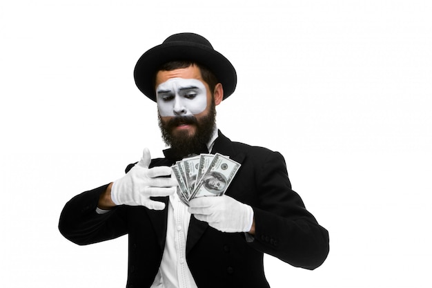 mime as businessman holding money