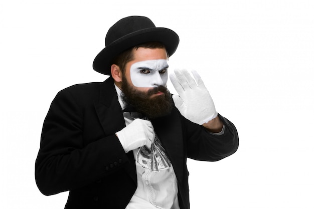 Free photo mime as businessman putting money in his pocket