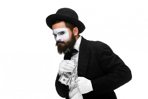 mime as businessman putting money in his pocket