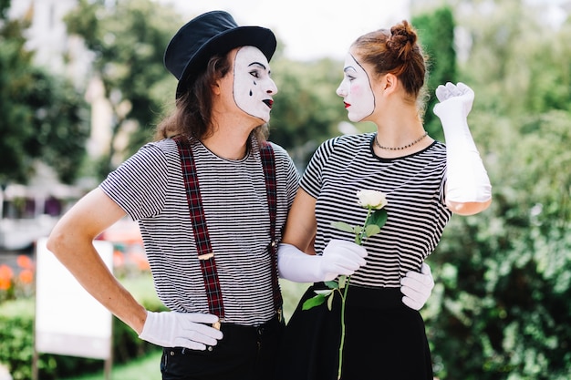 Free photo mime couple looking at each other