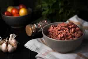 Free photo minced meat in bowl with ingredients