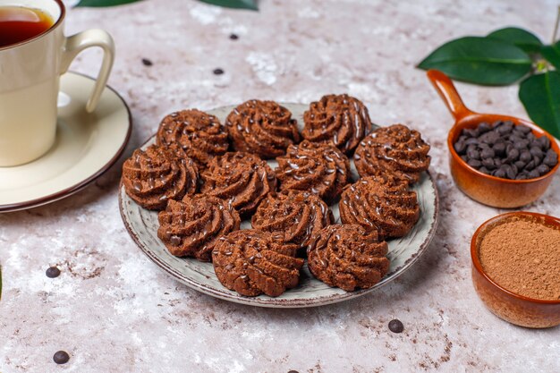 Mini cakes truffles with chocolate drops and cocoa powder