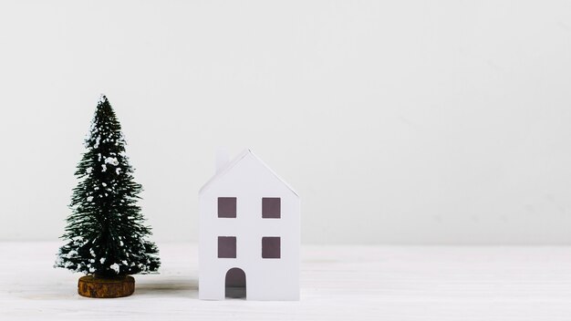 Miniature fir tree and house