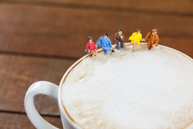 Miniature group of friends having coffee