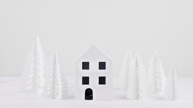 Miniature house with paper trees 