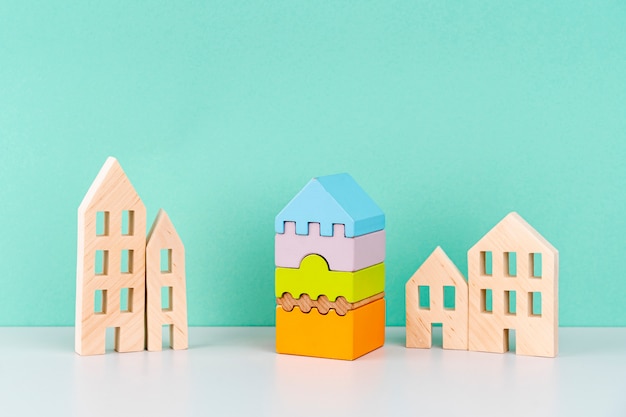 Miniature houses on blue background
