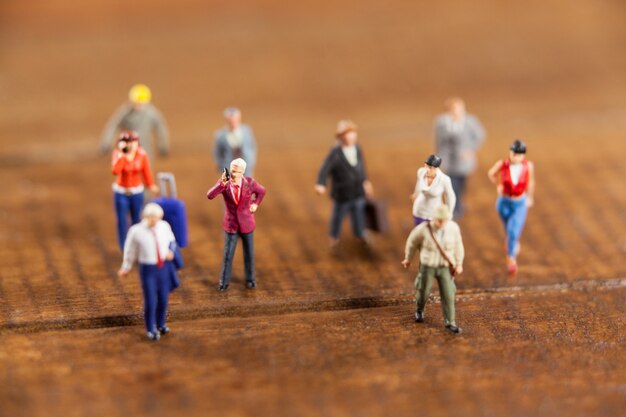 Miniature people travelling