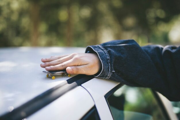 Miniature skateboard on car roof