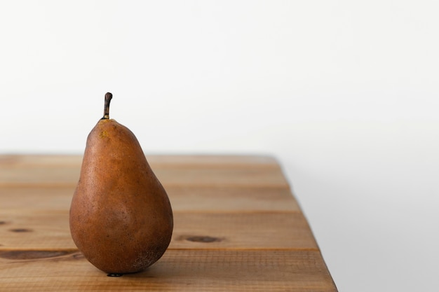 Minimal abstract concept pear on table front view