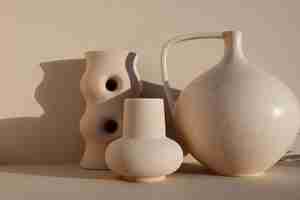 Free photo minimal different shaped vases arrangement