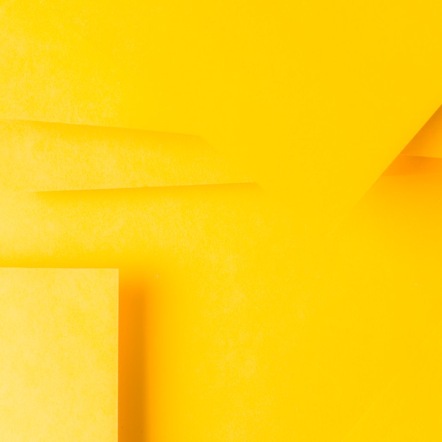 Minimal geometric shapes and lines on yellow paper
