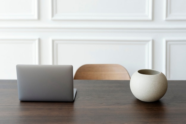 Minimal home office and workspace with laptop on the table