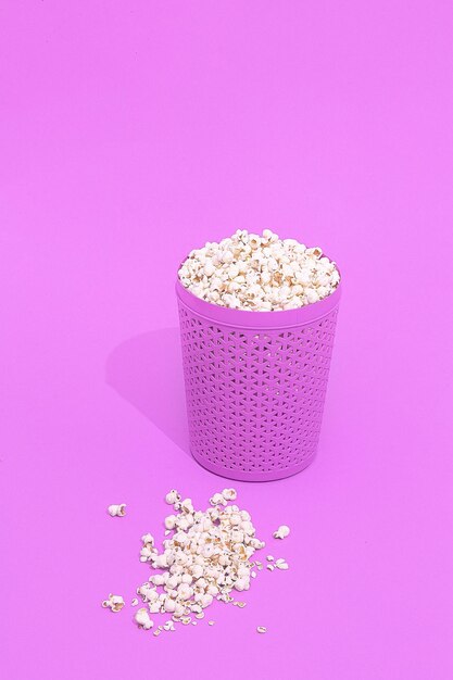 Minimal monochrome purple popcorn bucket.still life design. home cinema concept