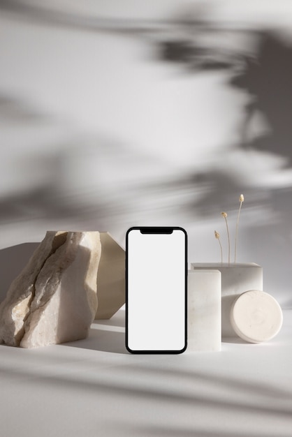 Minimal smartphone and rocks arrangement