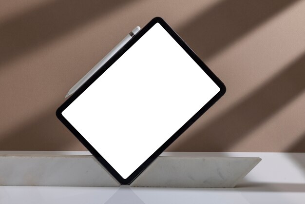 Free Photo minimal tablet and pen arrangement