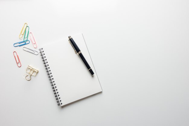 Minimal work space - Creative flat lay photo of workspace desk with sketchbook and wooden pencil on copy space white background. Top view , flat lay photography.