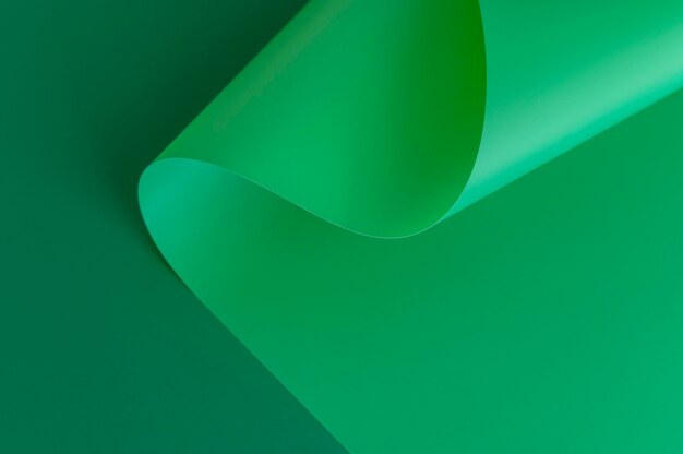 Minimalist abstract swirl of green paper