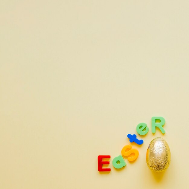 Minimalist arrangement of egg and letter