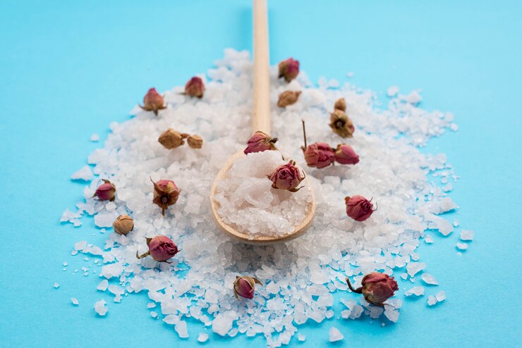 Free Photo minimalist bath salt spa concept and rose buds