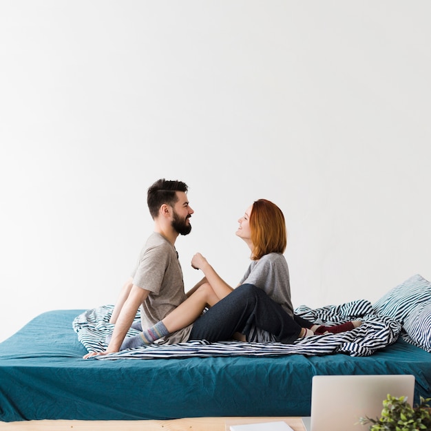 Minimalist bedroom design and couple looking at each other