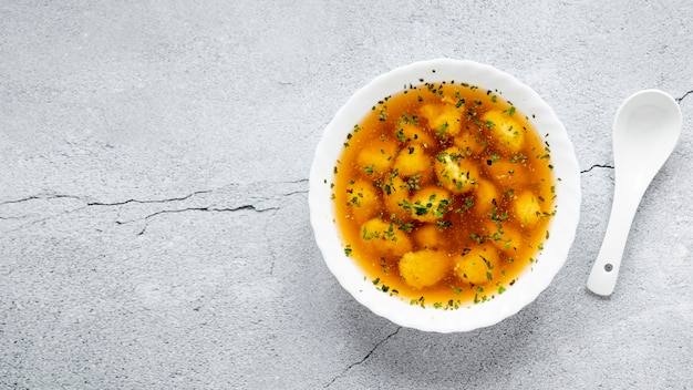 Minimalist bowl of dumpling soup