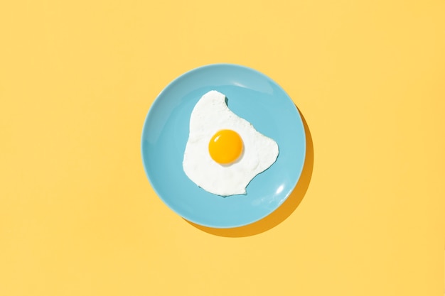 Minimalist composition with a dish of egg