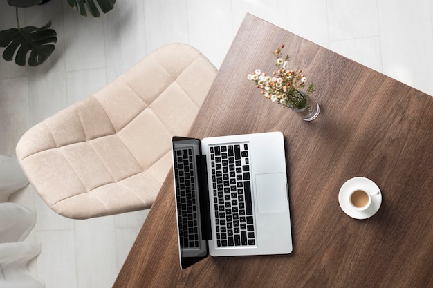 Free photo minimalist desk arrangement with laptop top view