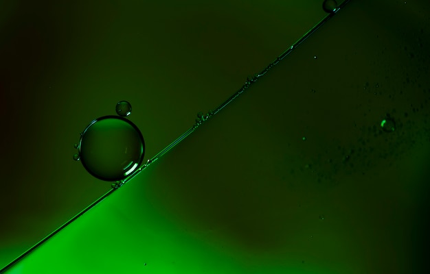 Minimalist gradient green bubbles on watery surface 