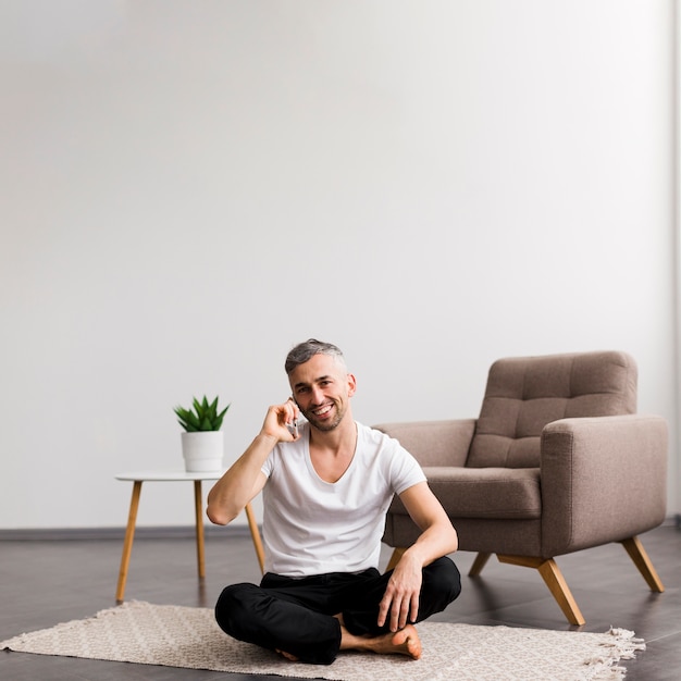 Minimalist home decor and man sitting on the floor