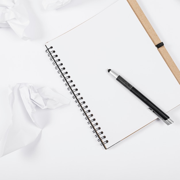 Free photo minimalist office arrangement with empty notebook