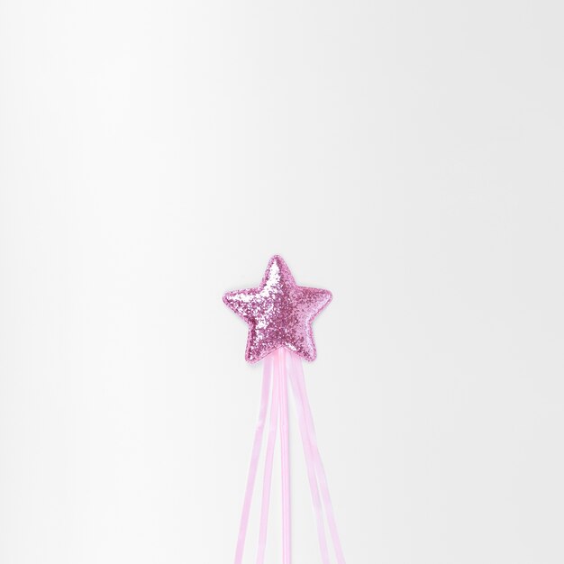 Minimalist pink star on white background