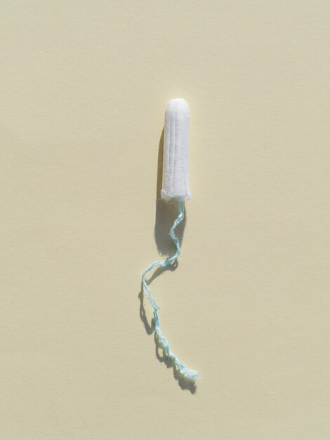 Minimalist tampon on grey background top view