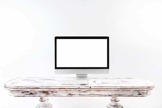 Minimalistic computer standing on vintage desk