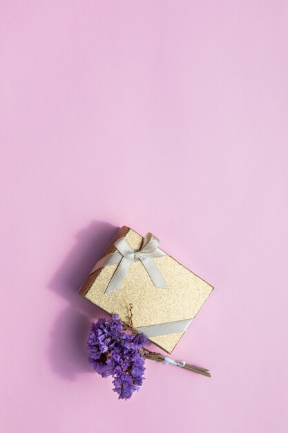 Minimalistic gift with flower and copy space