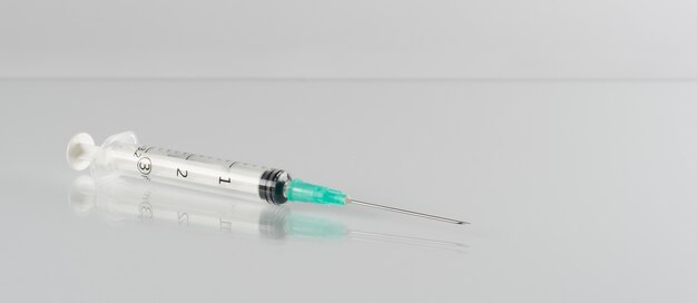 Minimalistic science banner with syringe