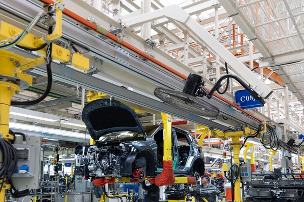 Minsk Belarus Dec 15 2021 Car bodies are on assembly line Factory for production of cars Modern automotive industry A car being checked before being painted in a hightech enterprise