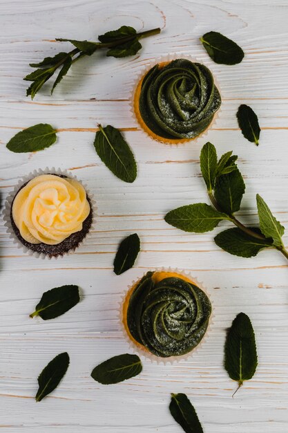 Mint leaves near cupcakes